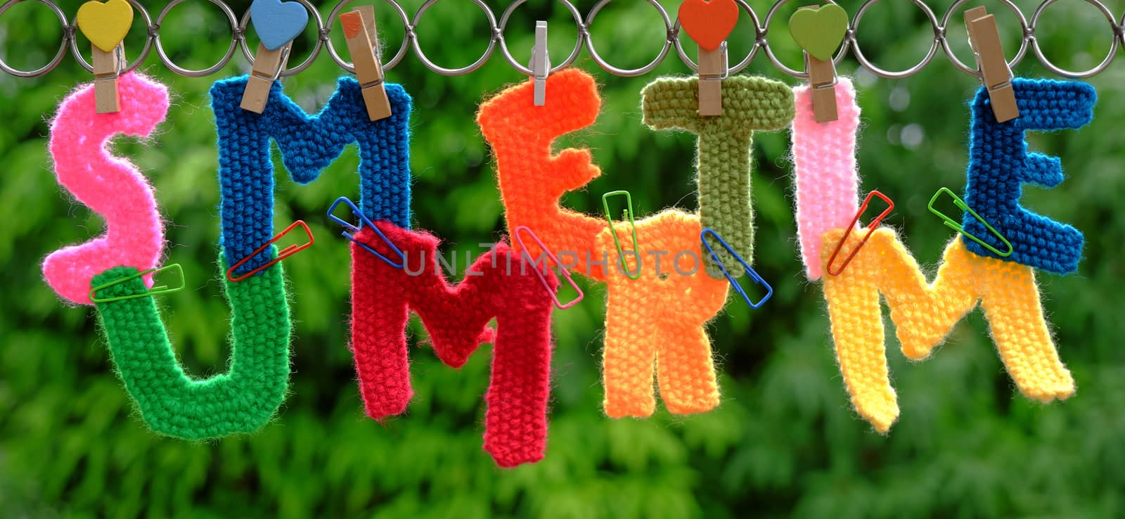 Summer letter hang on rope, summertime background with alphabet on green background
