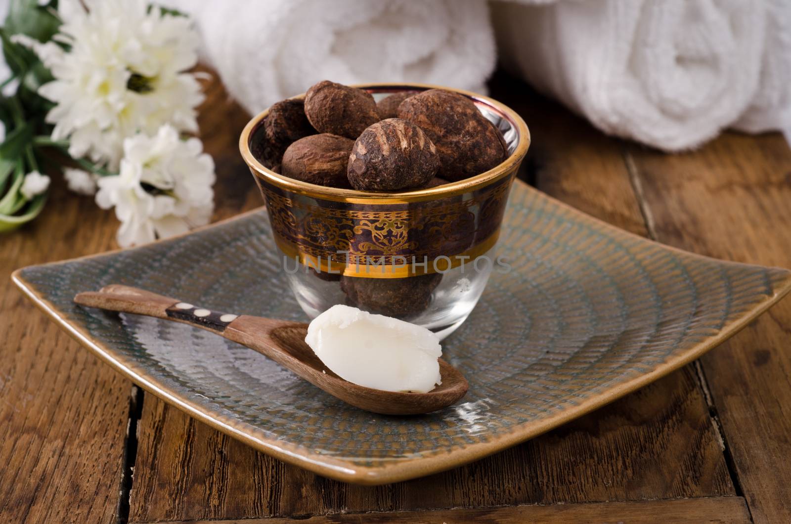 Shea butter nuts in a glass with shea butter