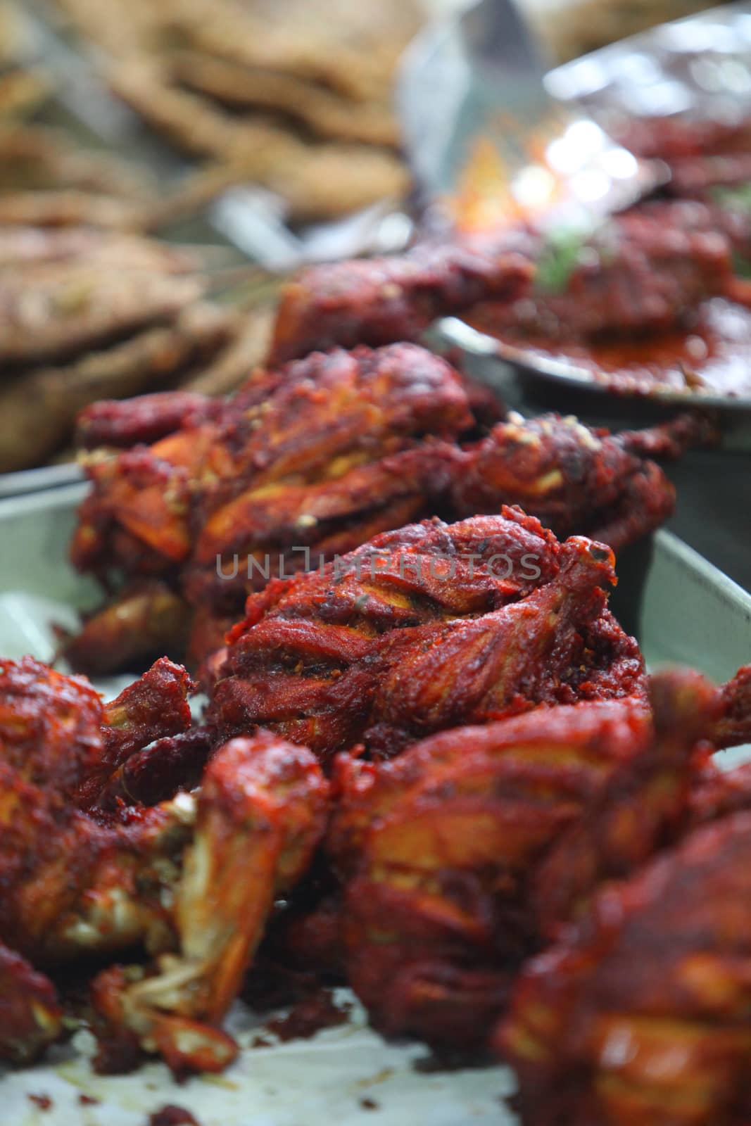 Delicious and spicy Indian delicacy tandoori chicken served in a plate