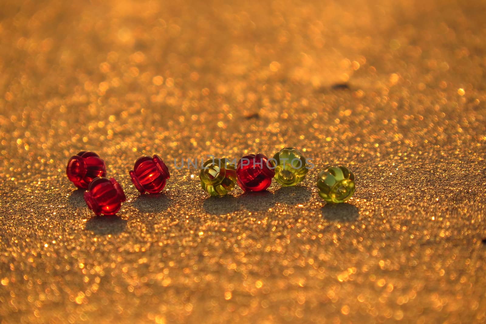 Glass Beads on Golden Sand