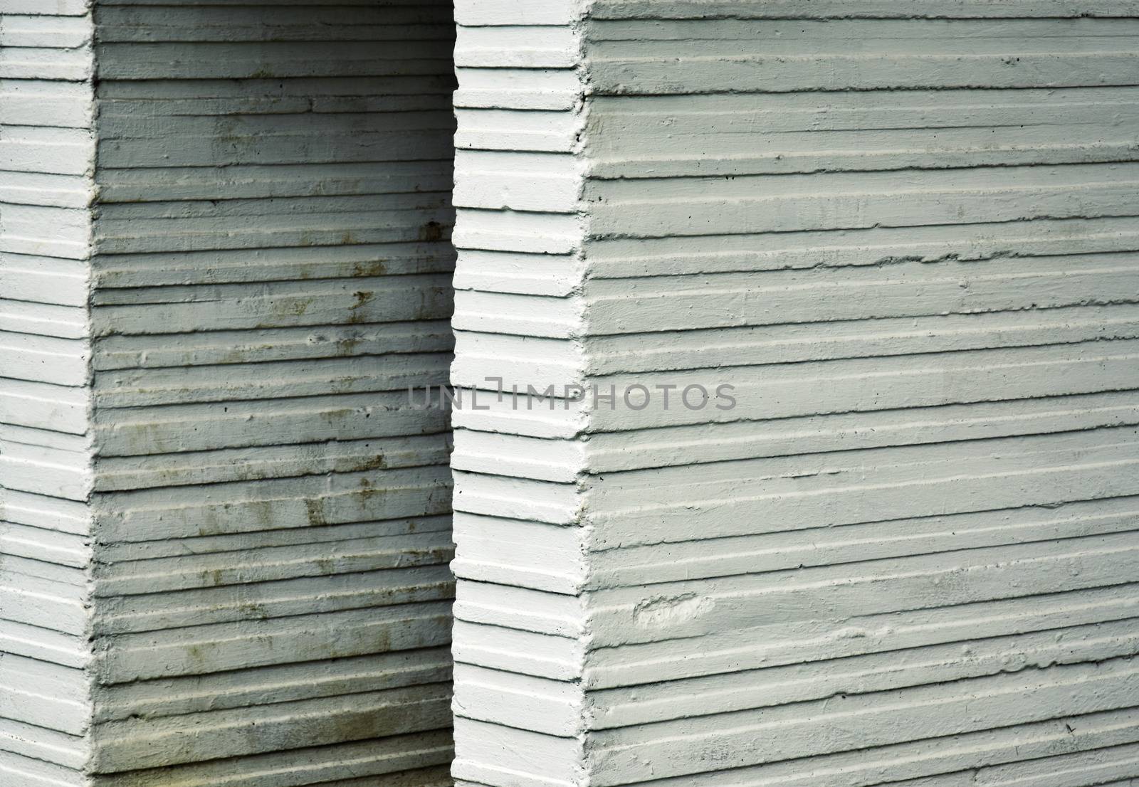 abstract background or texture Old White grooved concrete blocks