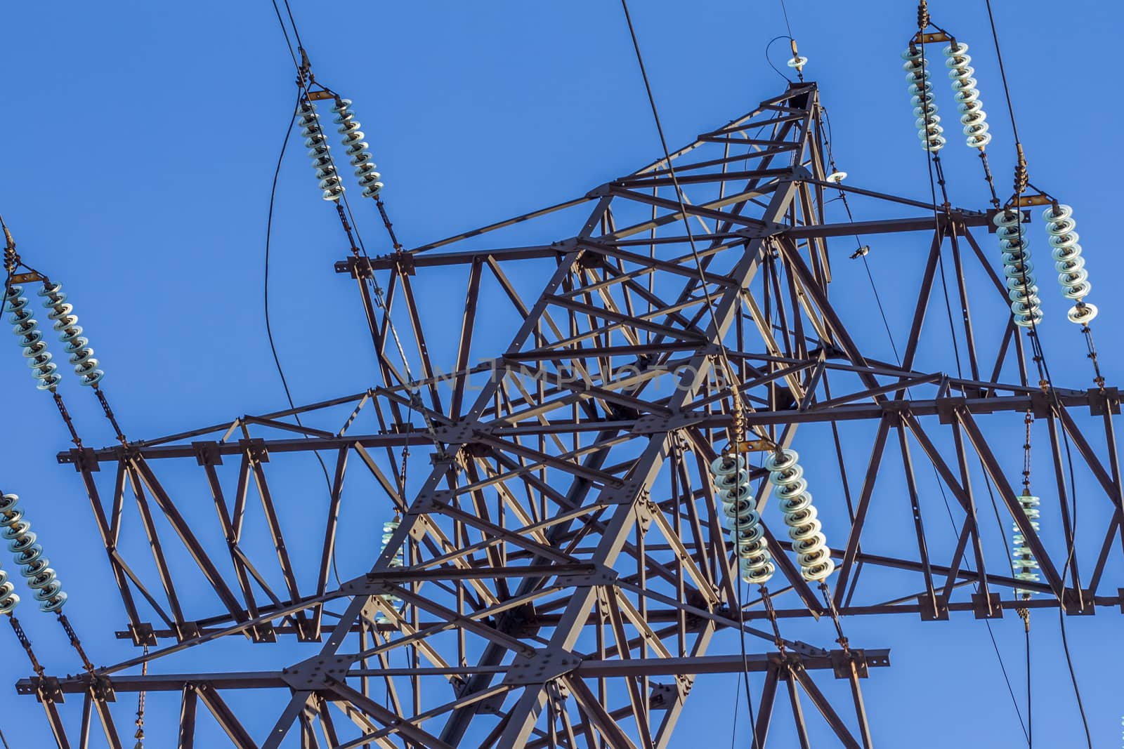electric insulator on the background of blue sky