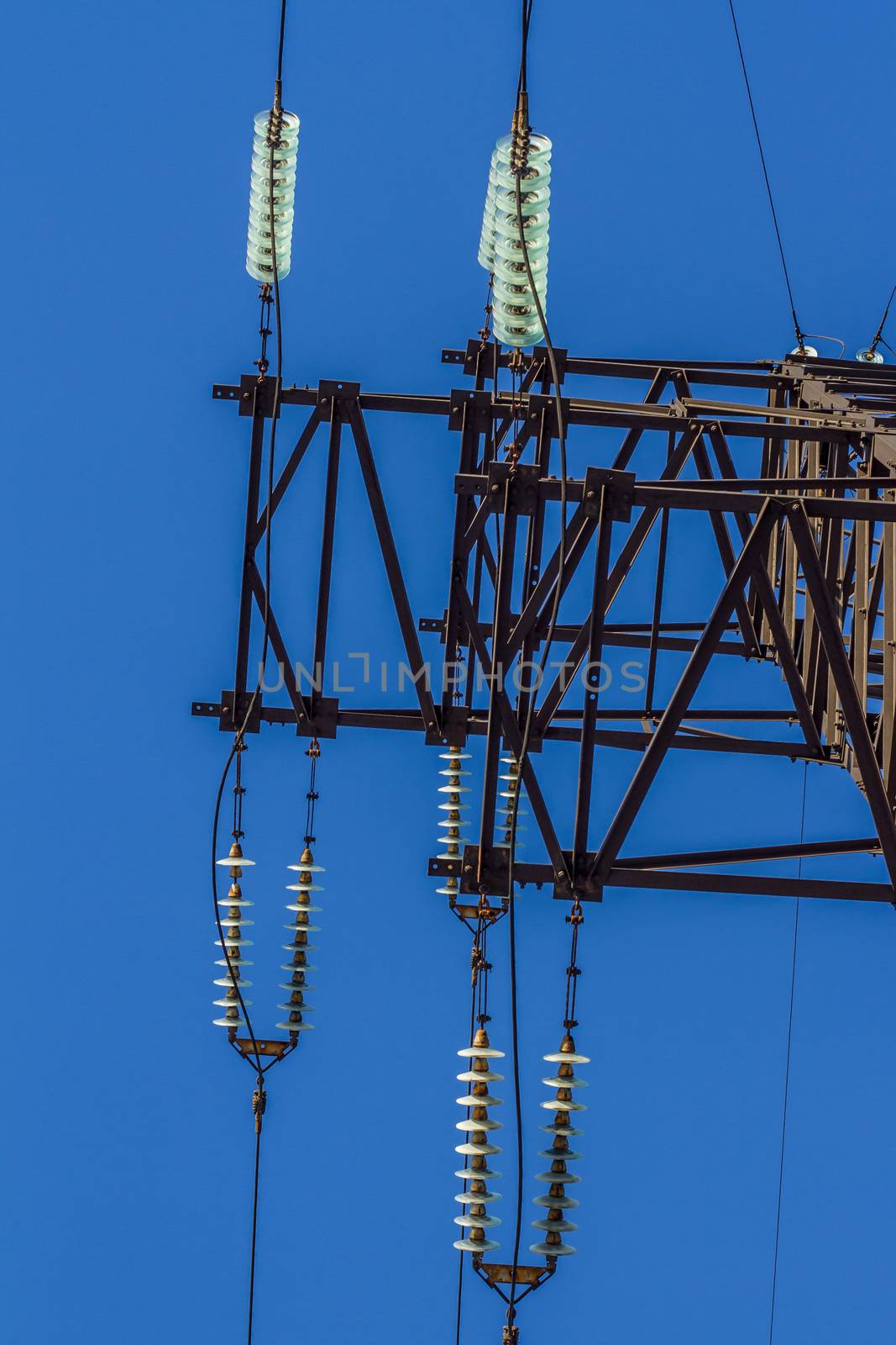 electric insulator on the background of blue sky