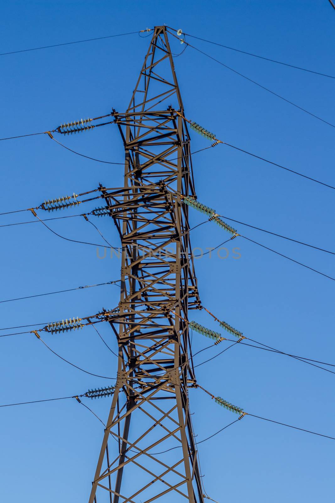 electric insulator on the background of blue sky