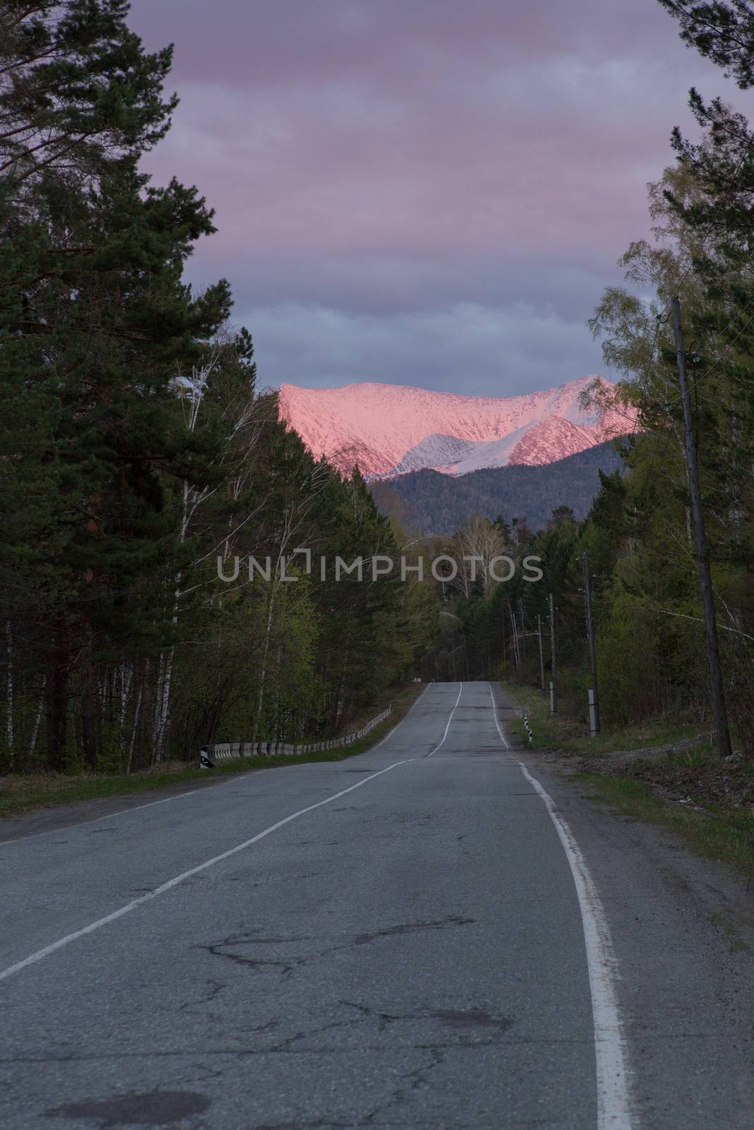 road at sunset ,the mountains in the glow of sunset