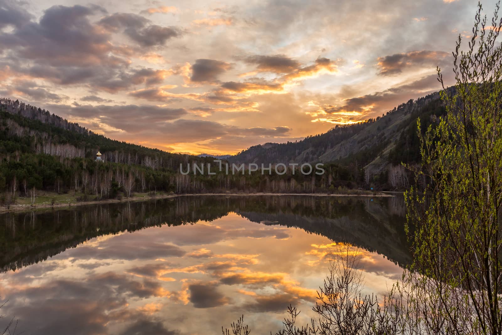 bright sunset on the lake reflection calm water