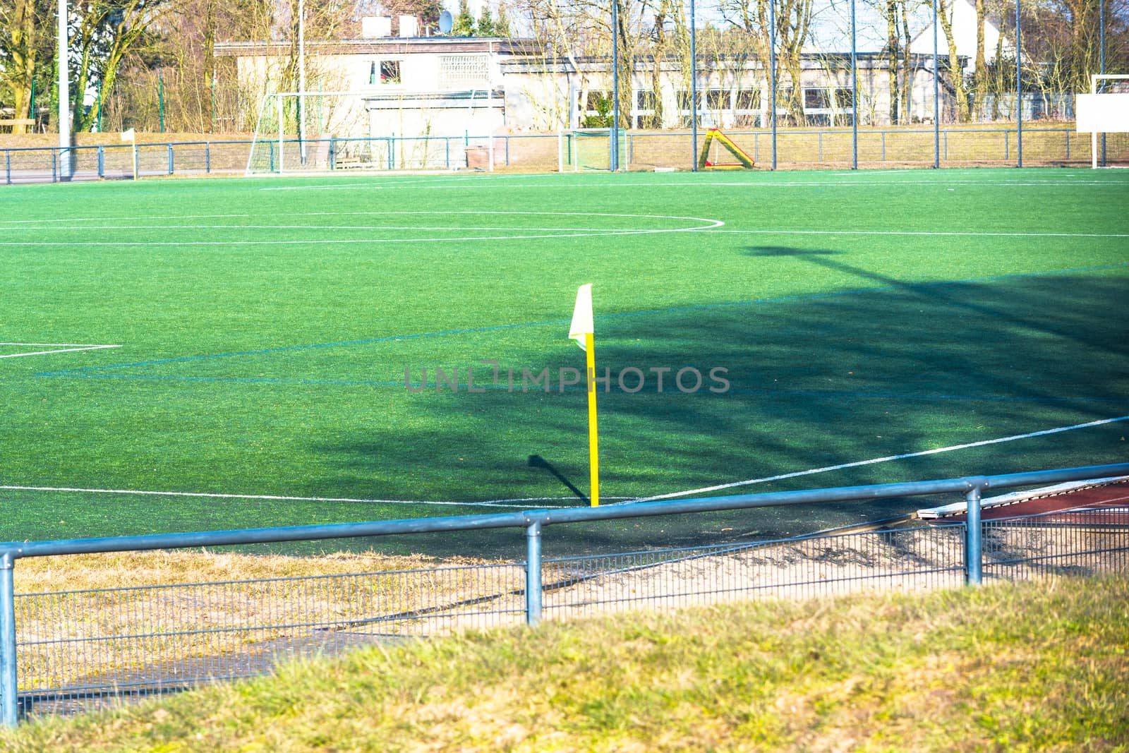 Yellow flag on a green football field.