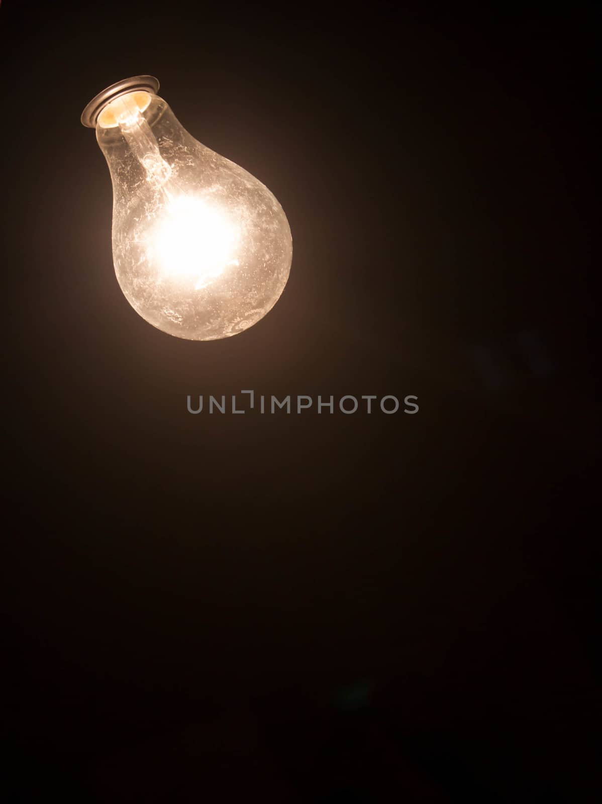 Glowing lamp on black