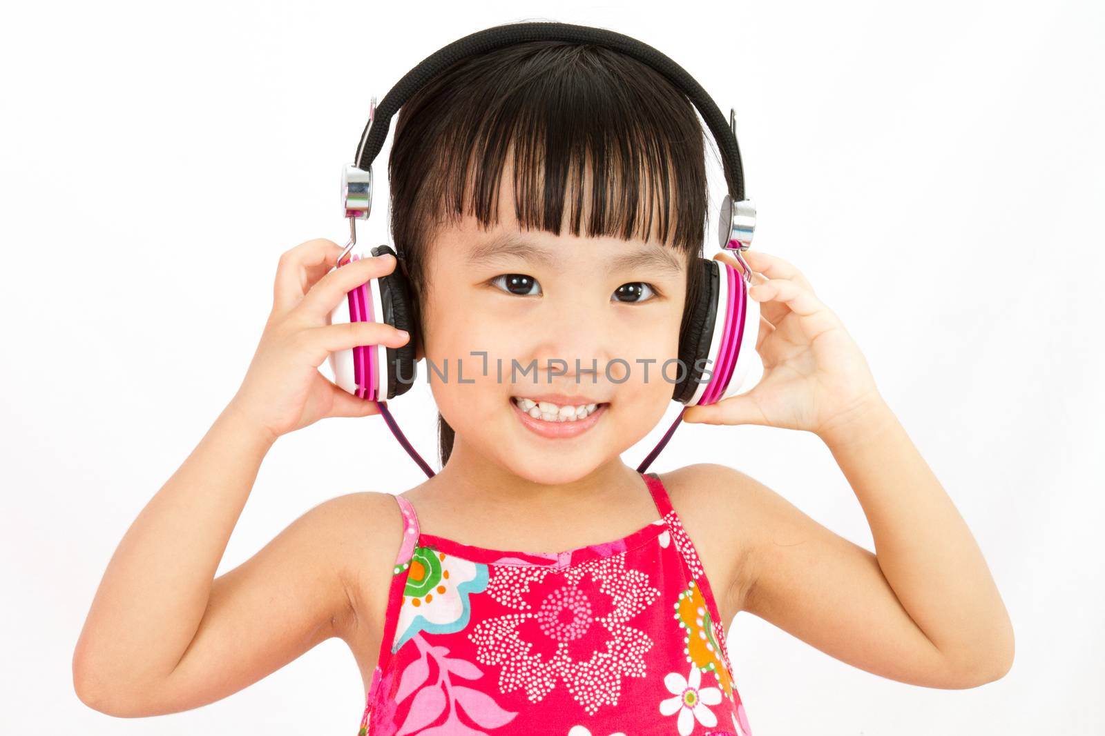Chinese little girl on headphones by kiankhoon