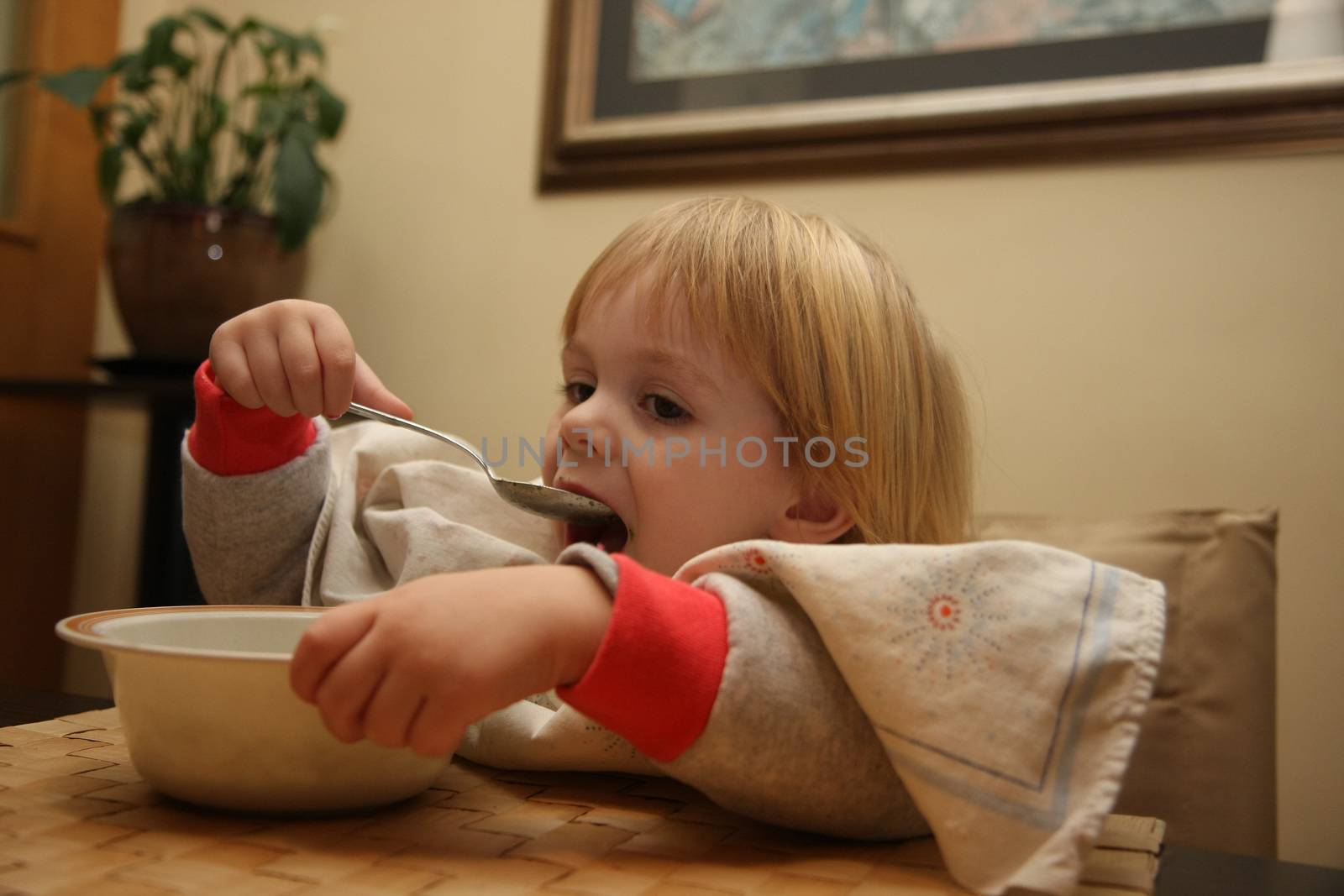 Young girl enjoys eating nettle chowder