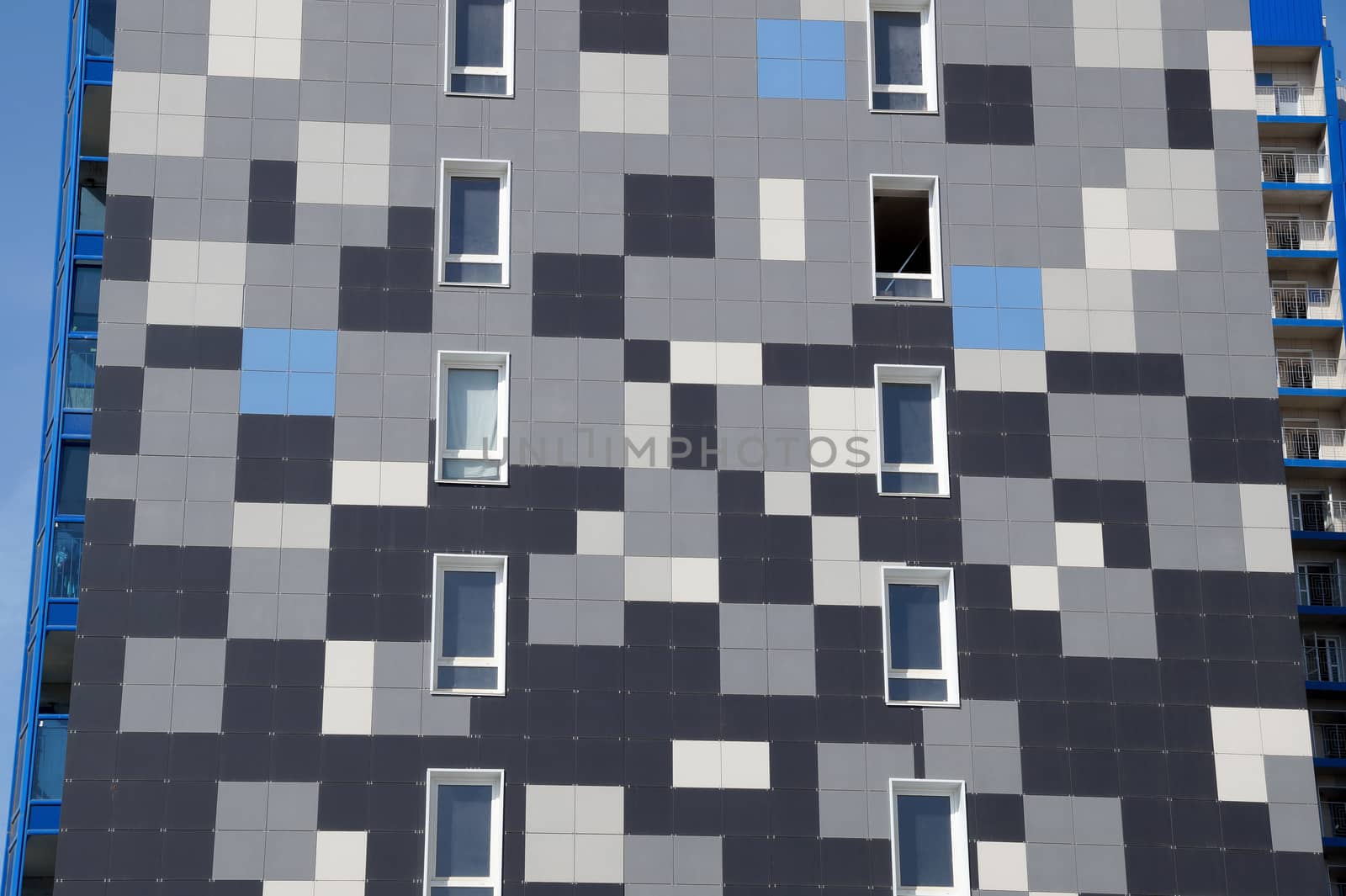The new house revetted with a multi-colored granite tile in the city of Volgograd