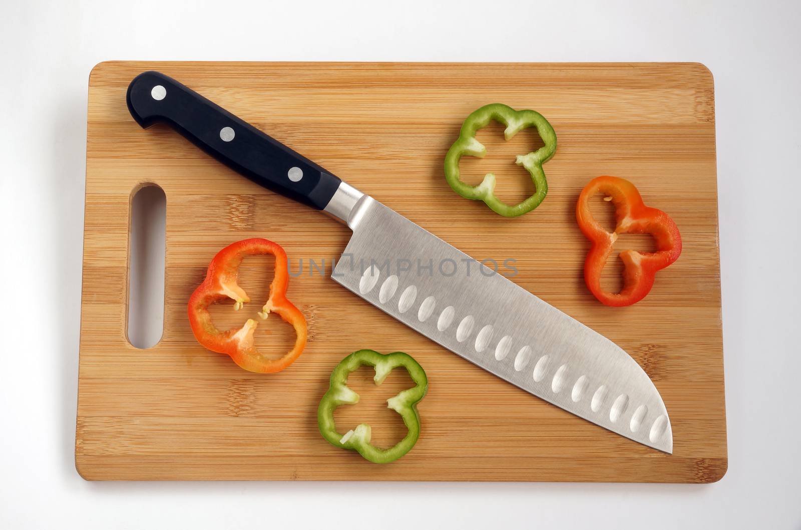 Knife cook universal with a blade like Santoku on a chopping board