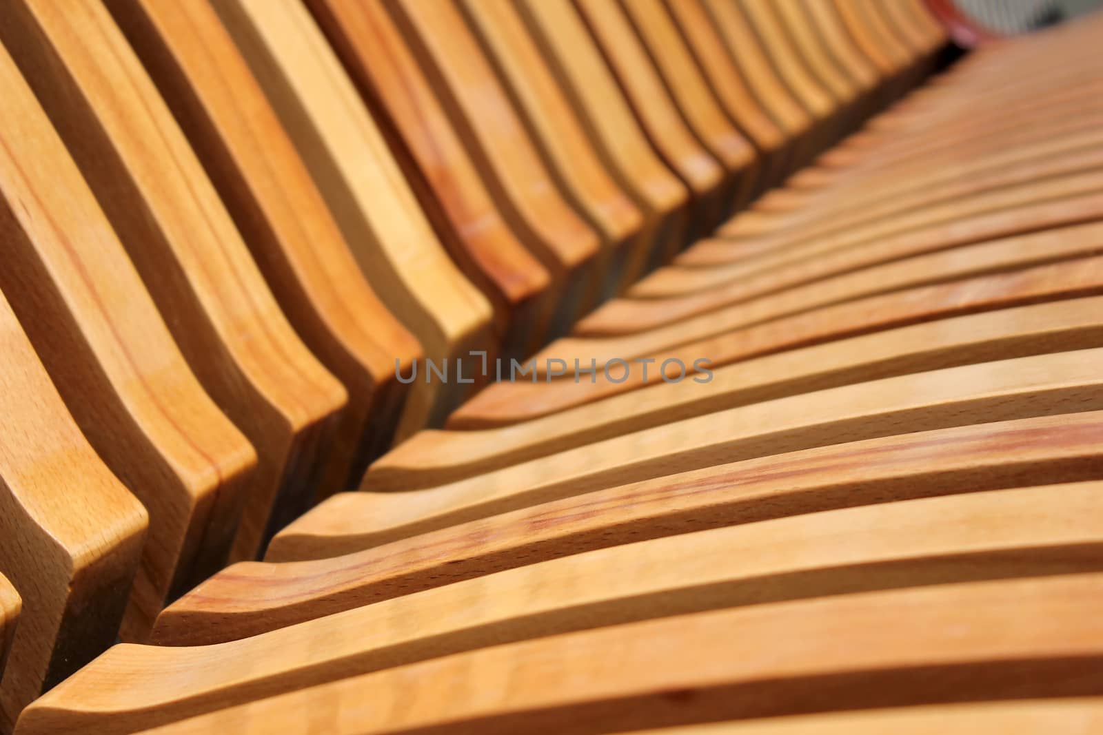 Wooden laths on a seat mat and on a back of a city shop