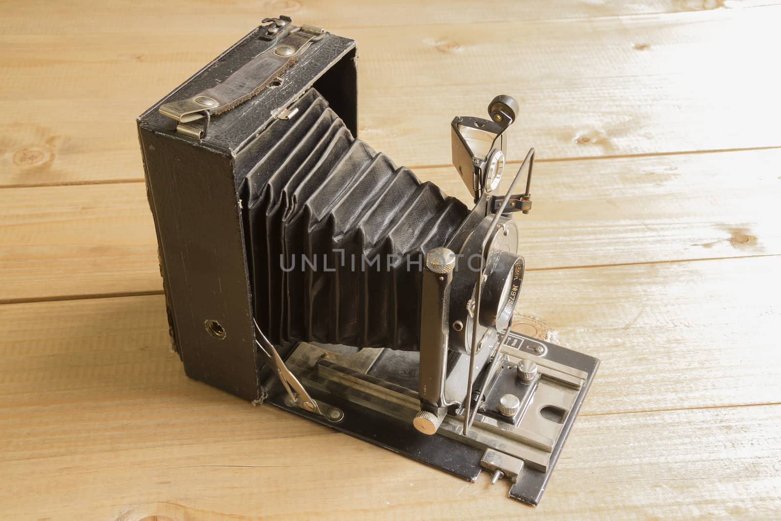 Vintage camera on the Brown wooden background