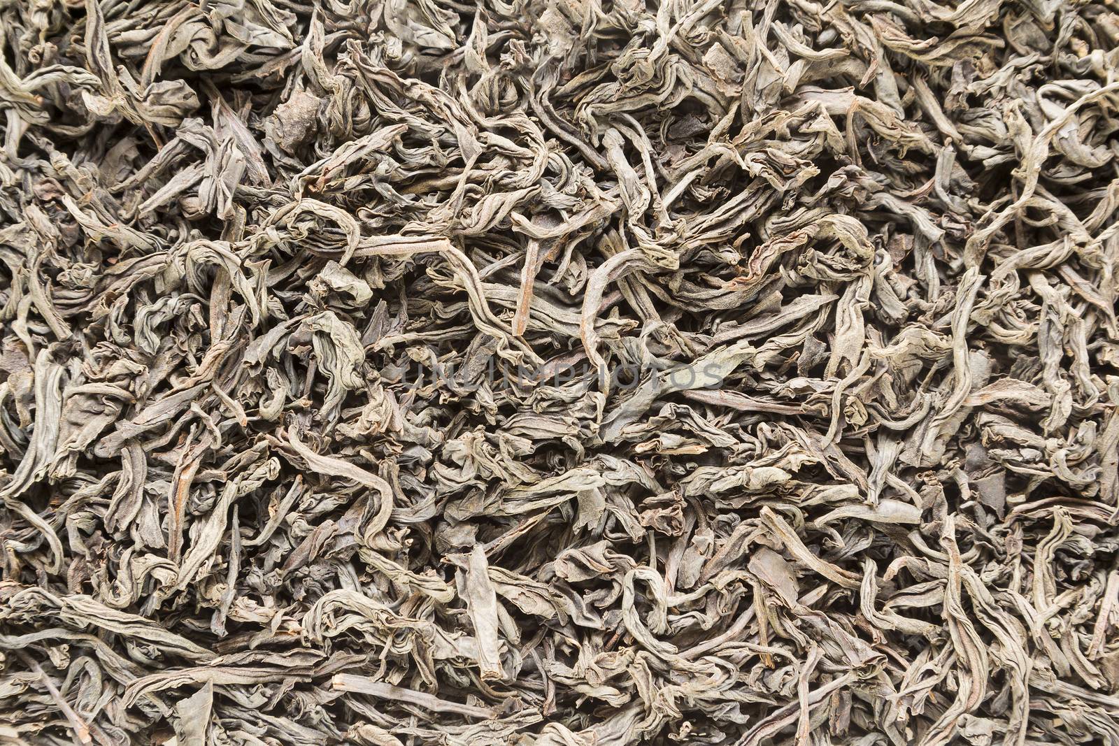 Background from dried leaves of Ceylon black tea close up