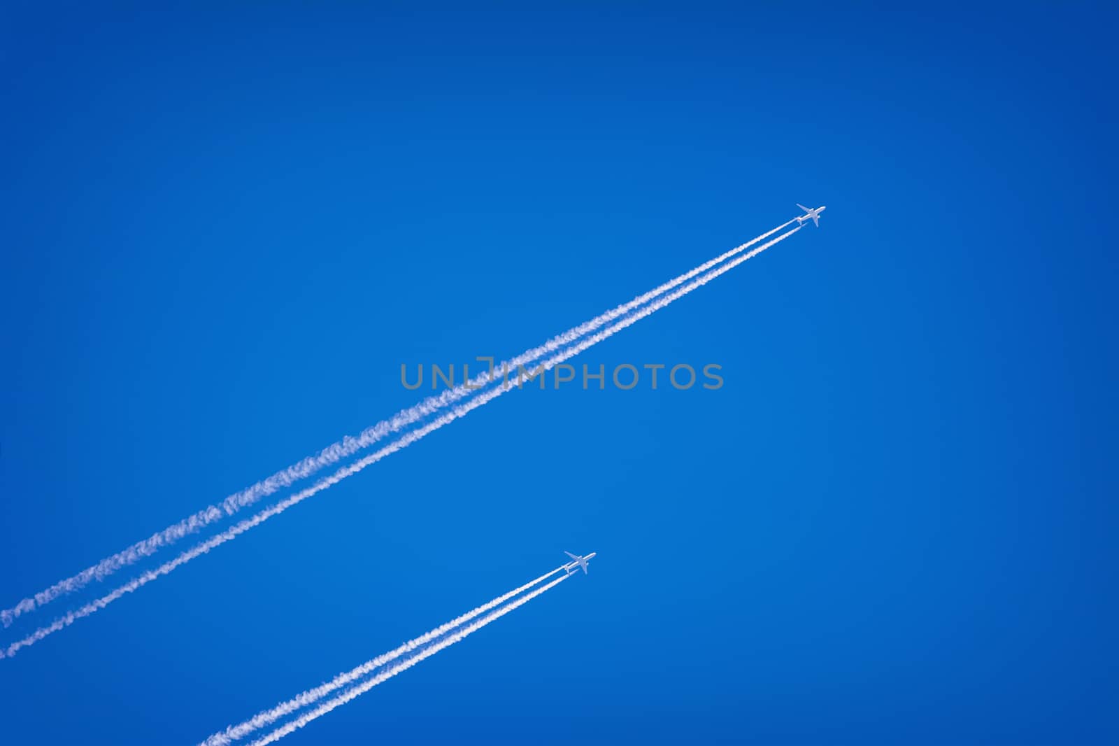 Two Jet Airplanes in the Blue Sky