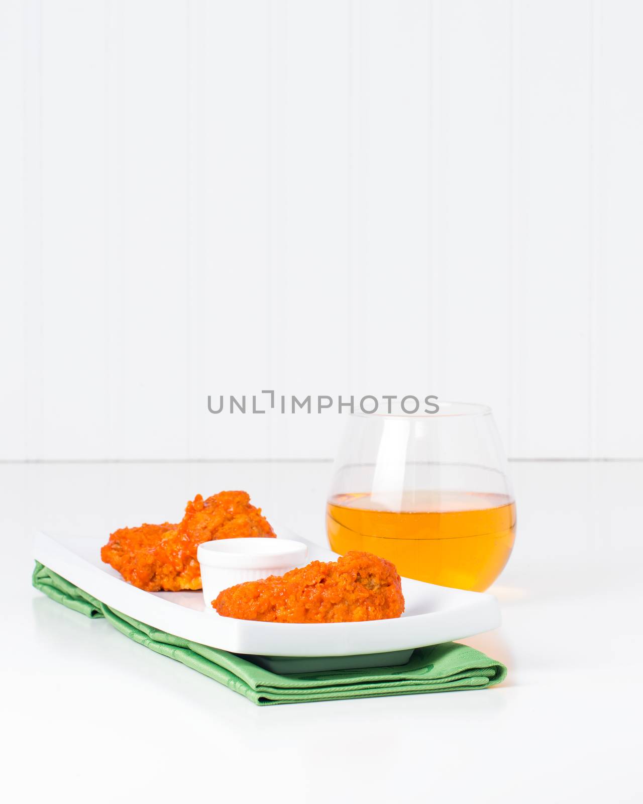 Buffalo chicken wings on a more elegant place setting.