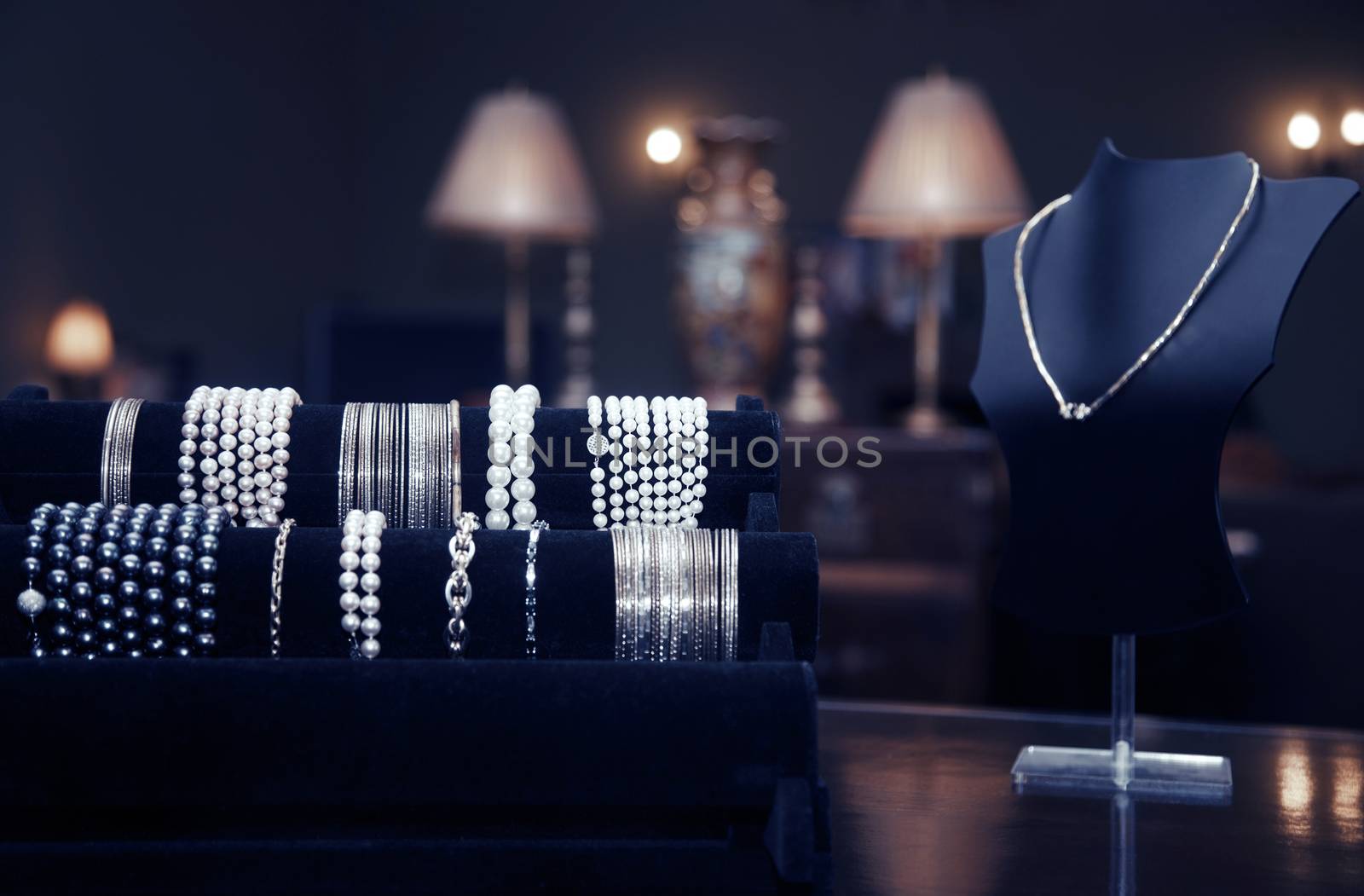 Assortment of jewelry in a jewelry shop. Close-up view