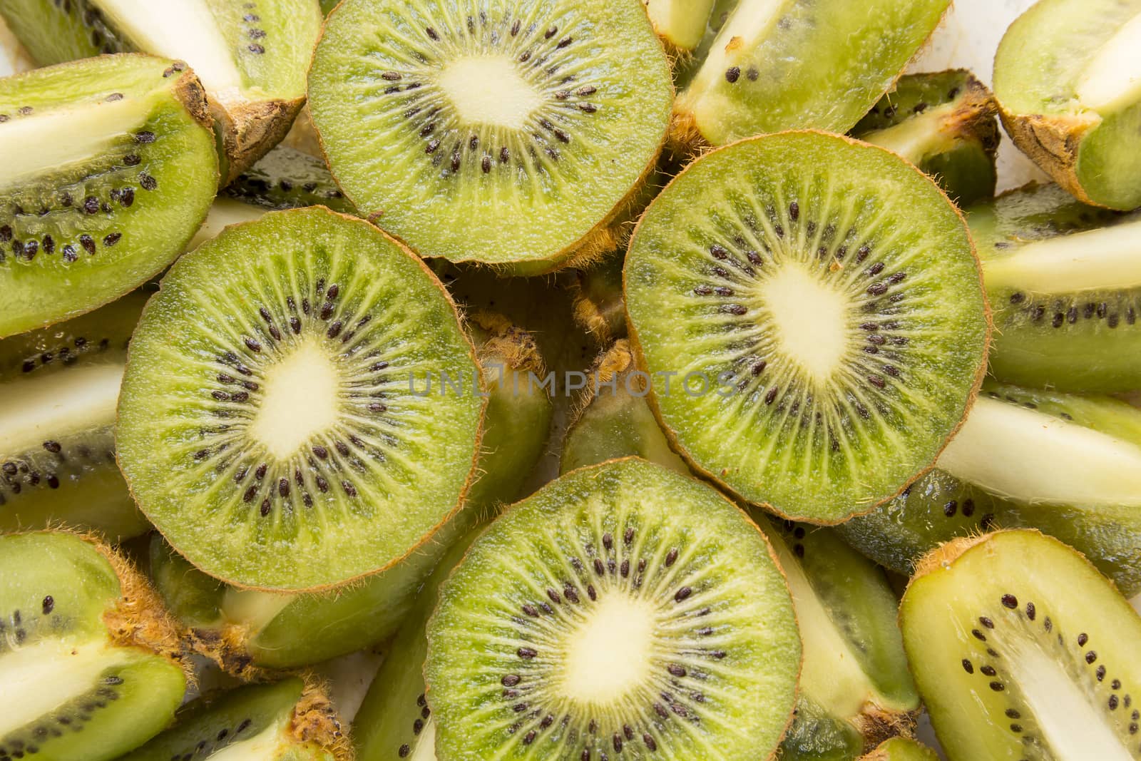 Fresh organic Kiwi Fruit Slices arranged showing the pips & structure