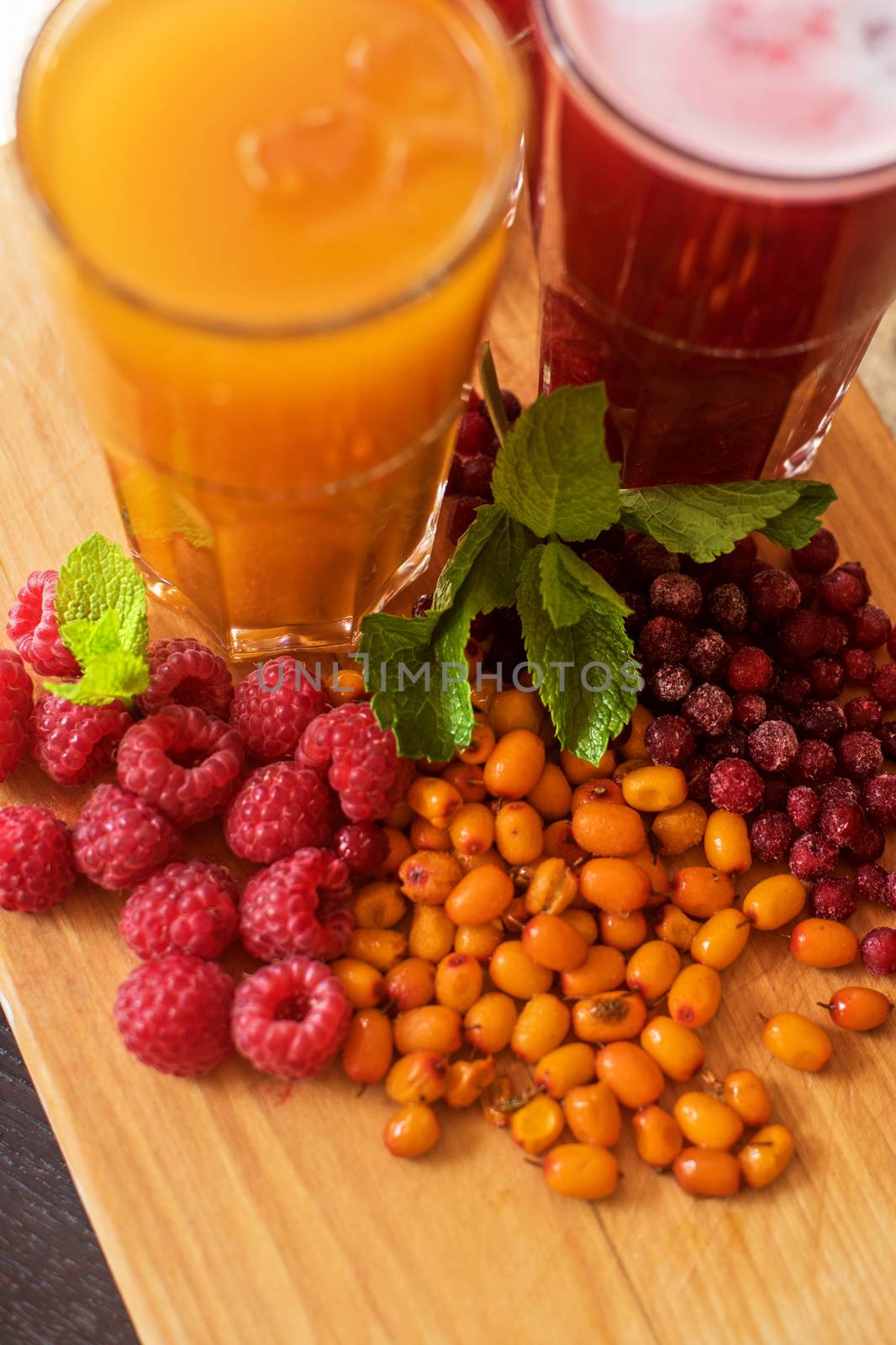 set of fruit non-alcoholic drink with cranberries raspberries and sea buckthorn