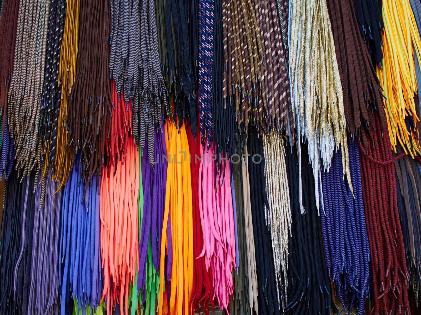 Display of bright colorful shoe laces in a shop