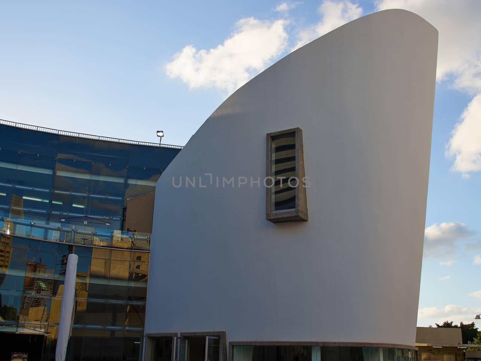 Futuristic modern architecture congress conference center with sky background    