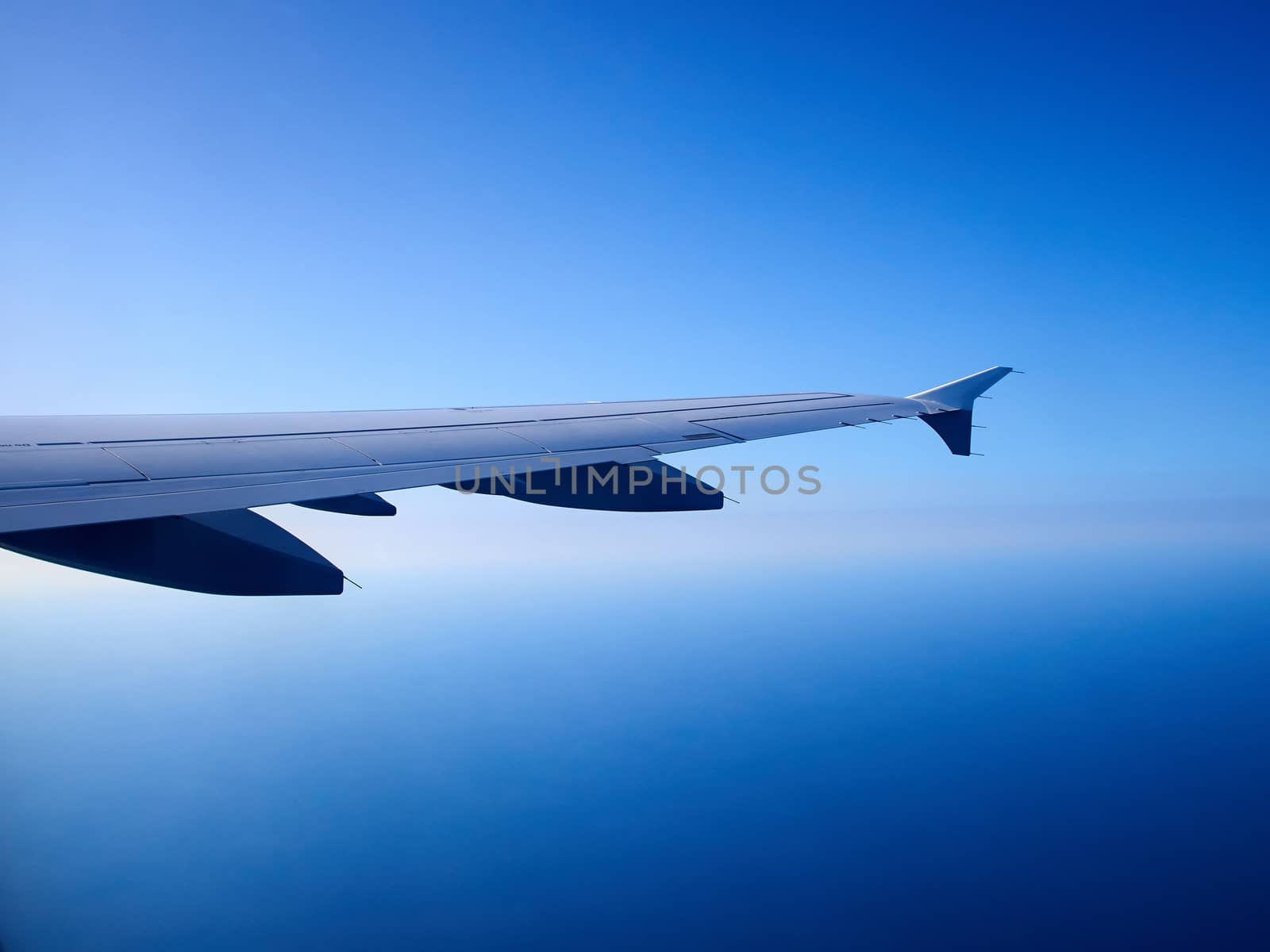 Airplane flying above clouds in clear blue sky great travel transportation background image 