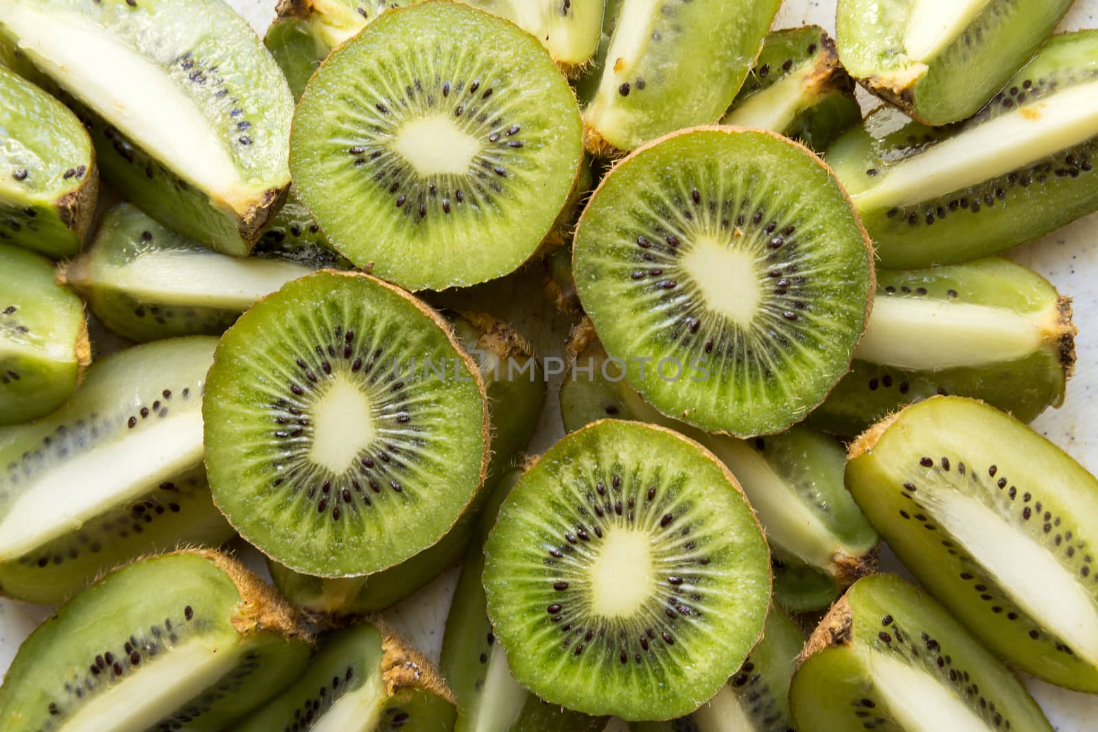 Fresh organic Kiwi Fruit Slices arranged showing the pips & structure