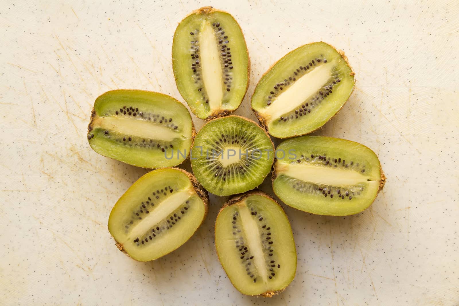 Fresh organic Kiwi Fruit Slices arranged showing the pips & structure