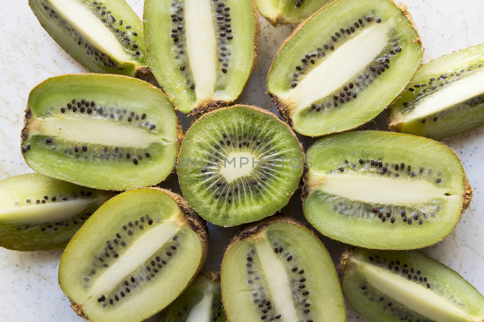Fresh organic Kiwi Fruit Slices arranged showing the pips & structure