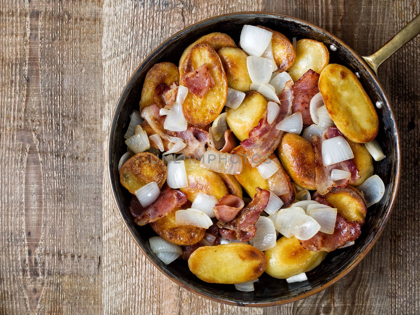 close up of rustic german home fries bratkartoffeln