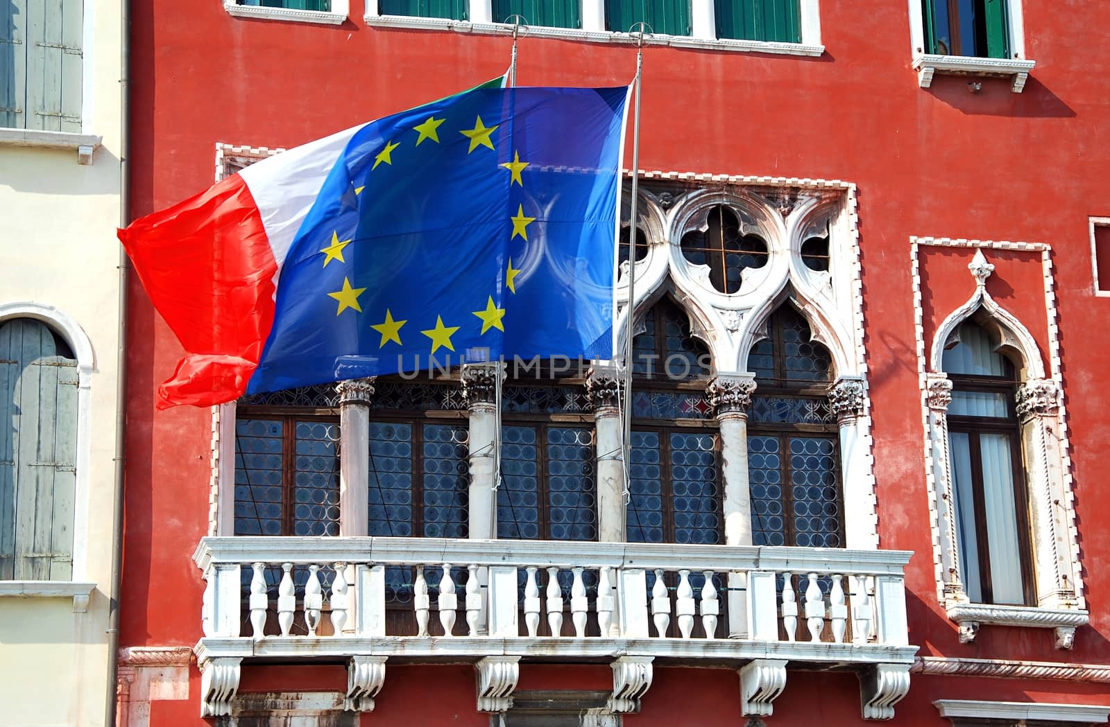 House with flags in Venice.  by hamik