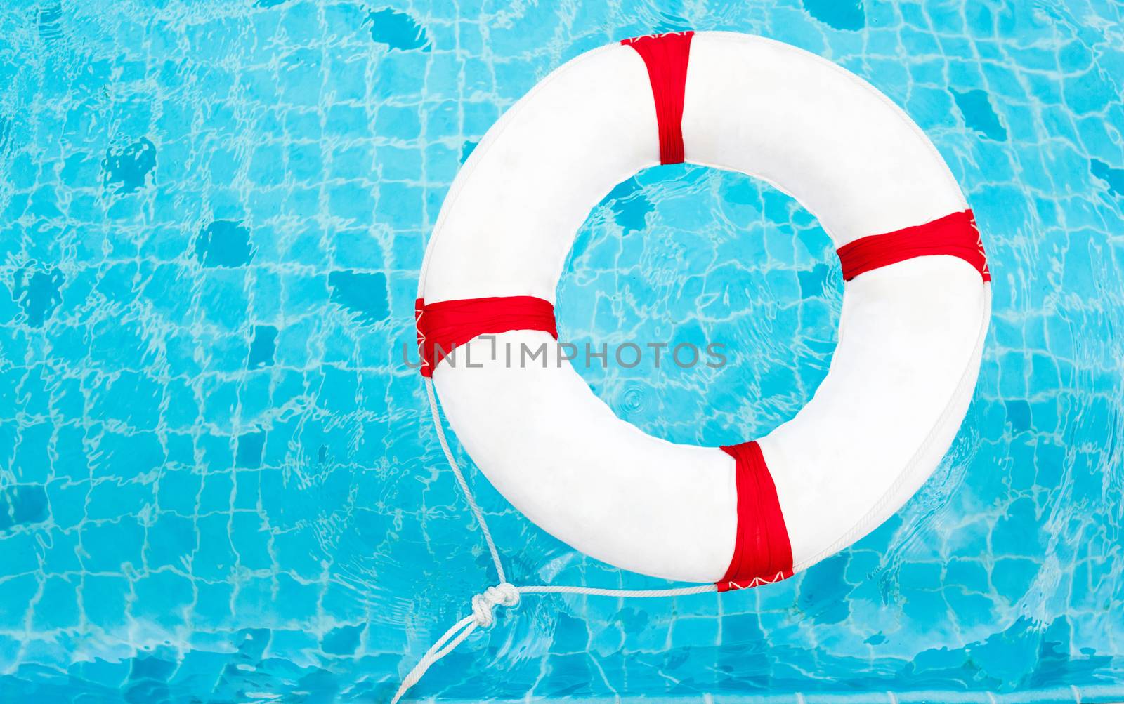 Life Ring at the swimming pool. Life Ring on water. Life Ring on by nopparats