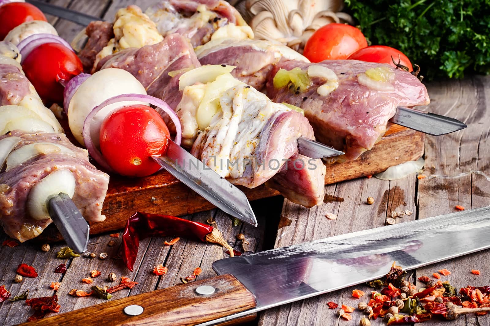 Raw meat marinated in spices threaded on skewers