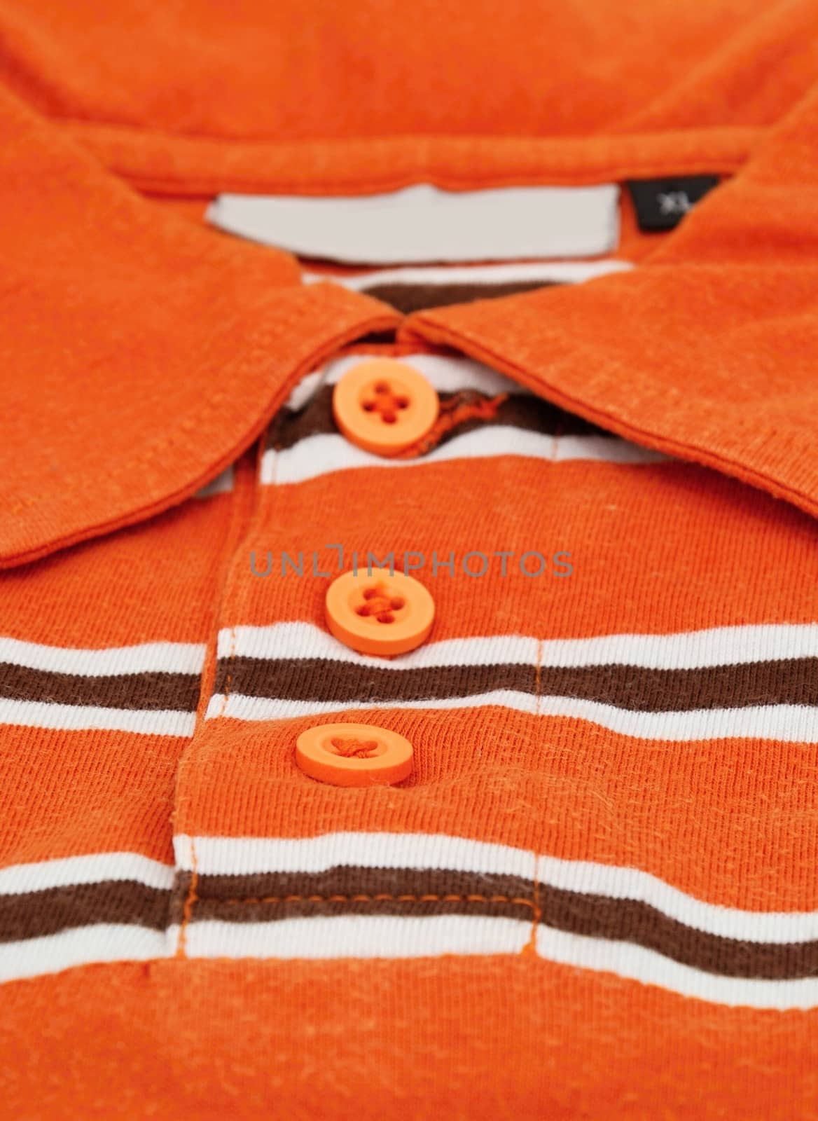 Detail image of orange shirt.