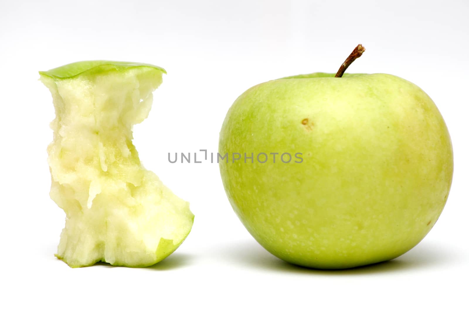 Closeup image of green apples on the white background.