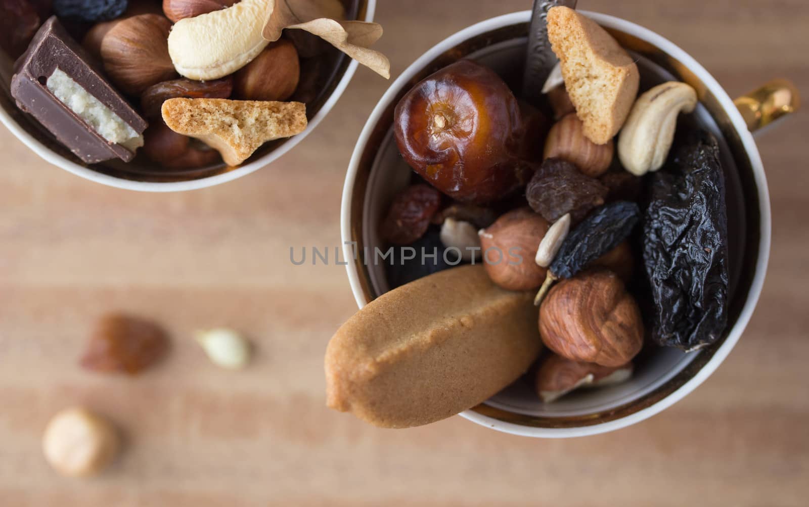 dried fruit mix in cup with spoon