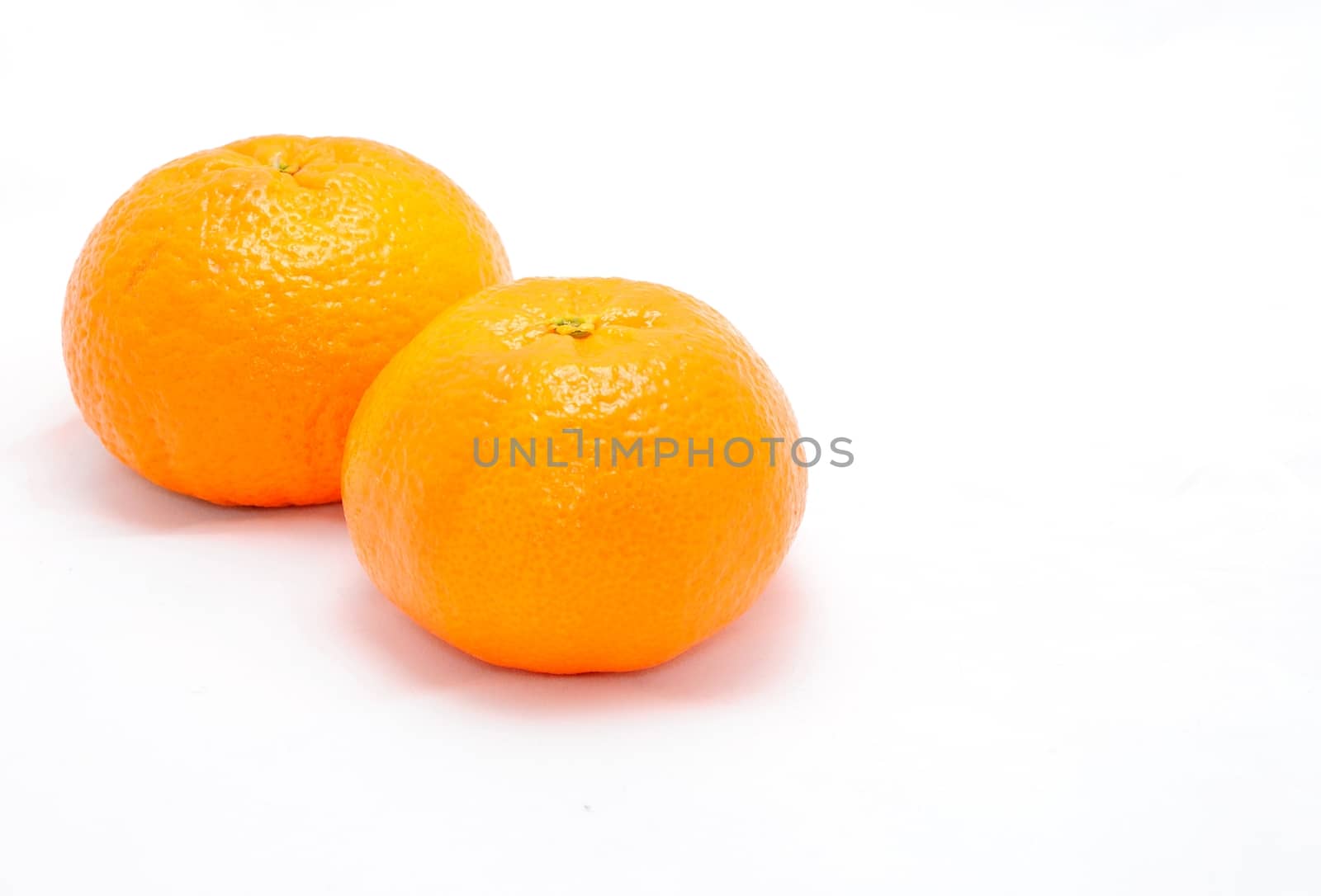 Detail image of mandarine isolated on the white background.