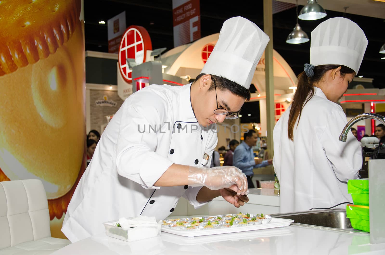 NONTHABURI - MAY 25 : Chefs are cooking demonstrations to visitors in during exhibition of THAIFEX - World of food ASIA 2016 on May 25, 2016 in Nonthaburi, Thailand.
