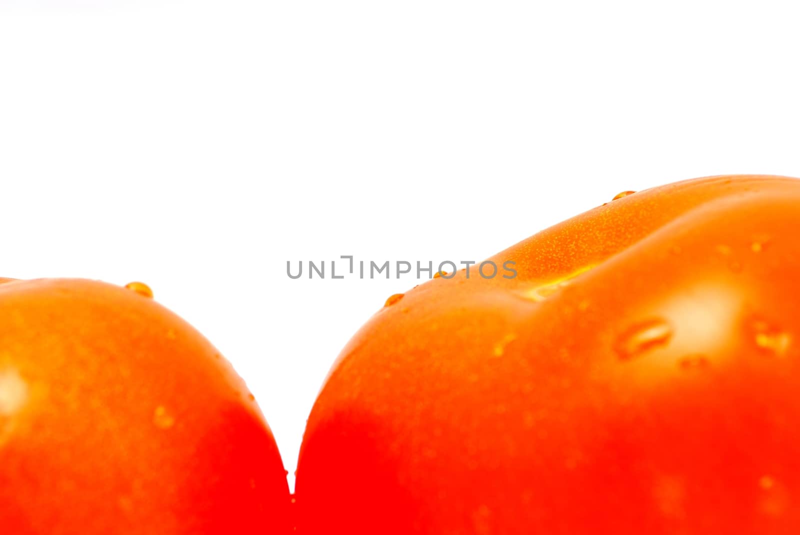 Closeup image of tomato isolated n the white background.