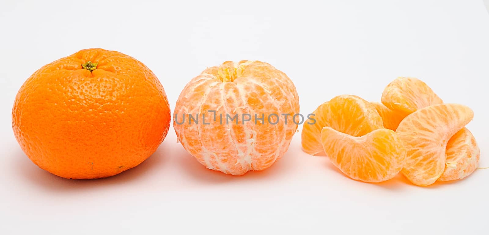 Detail image of mandarine isolated on the white background.