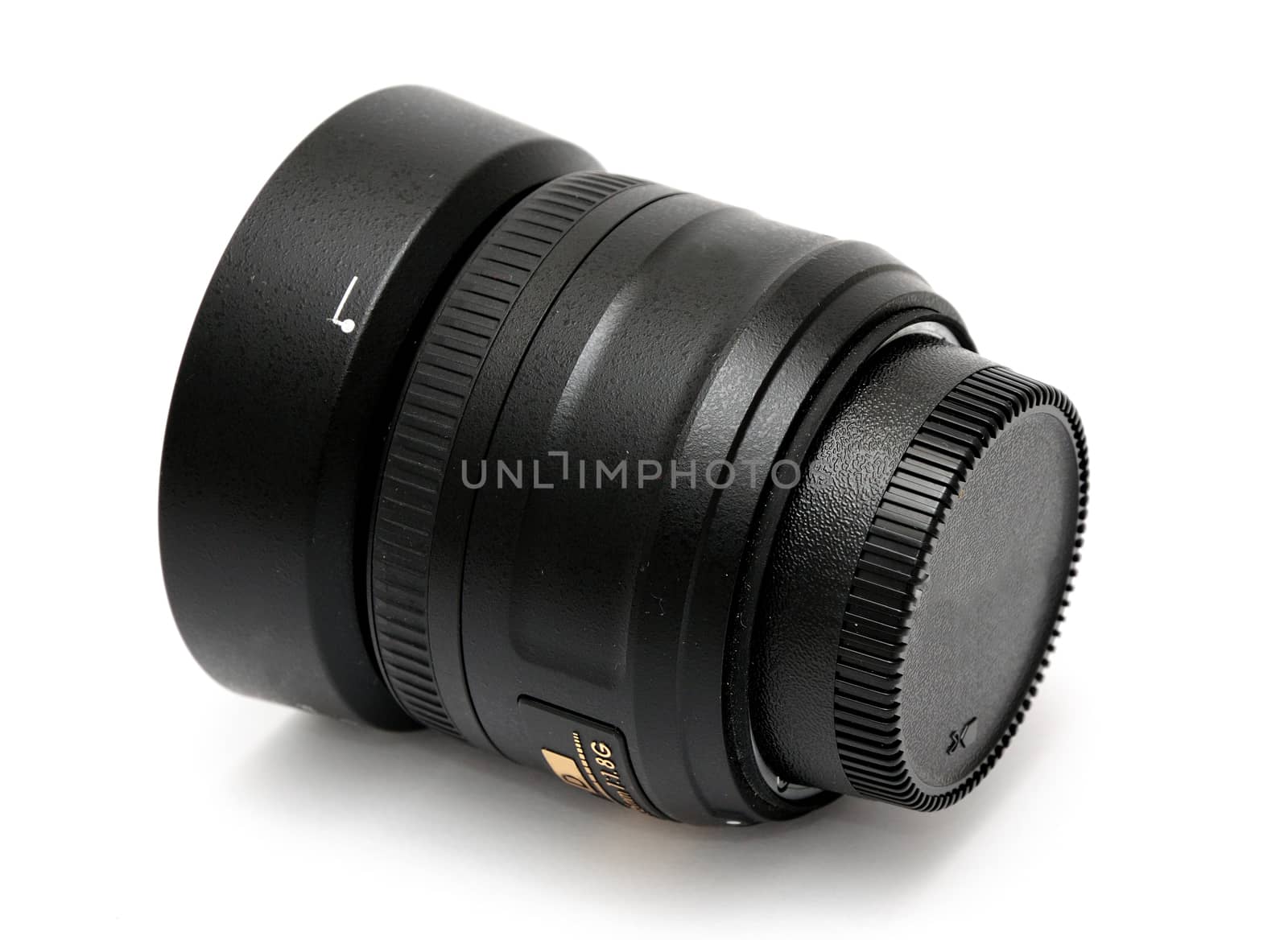 Closeup image of black lens placed on the white background.