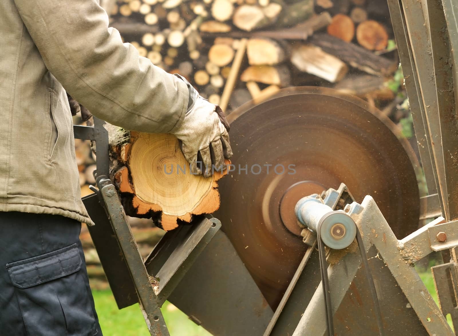 Working man with the circular saw.