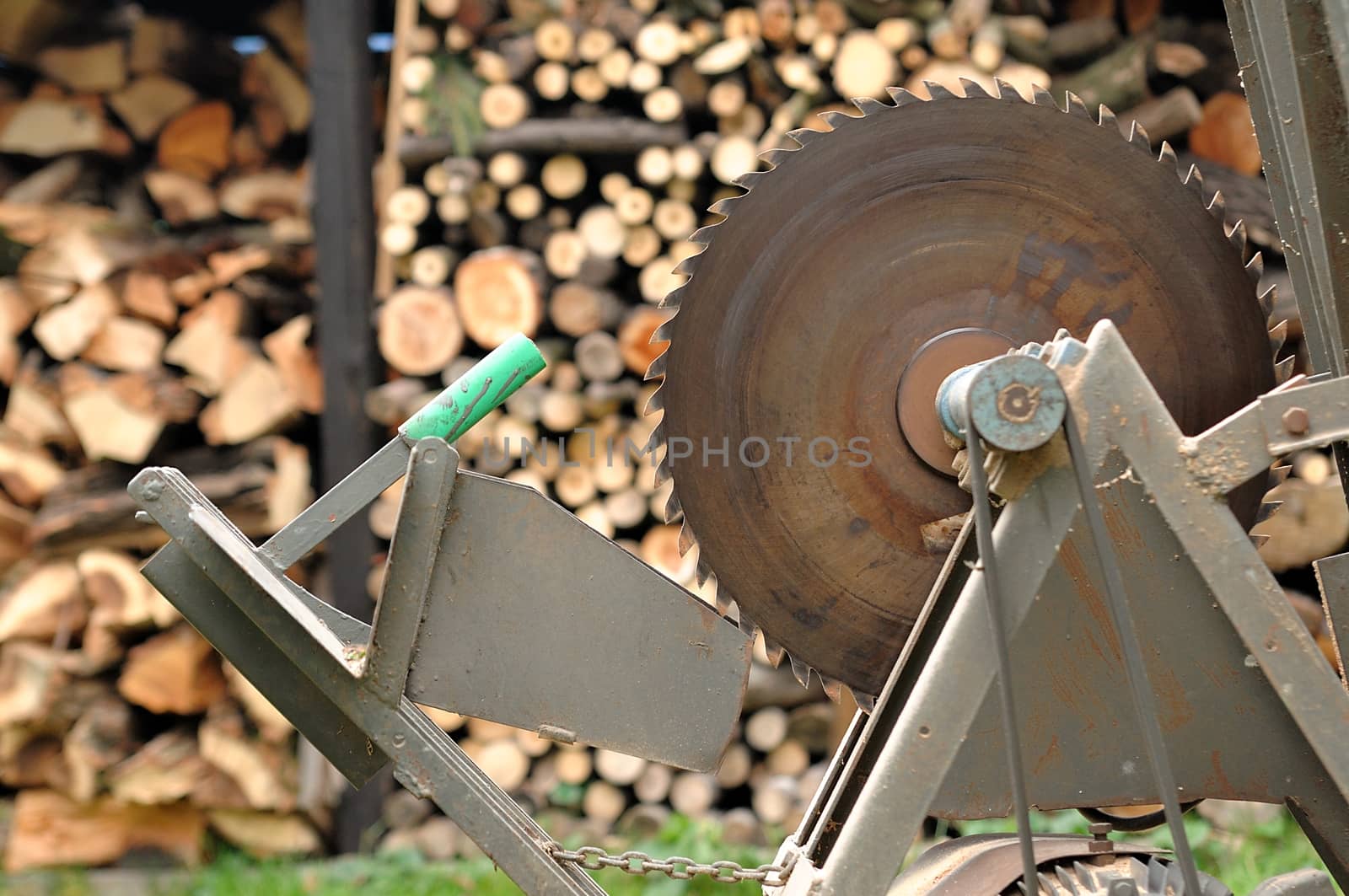 Circular saw with woodshed in background.