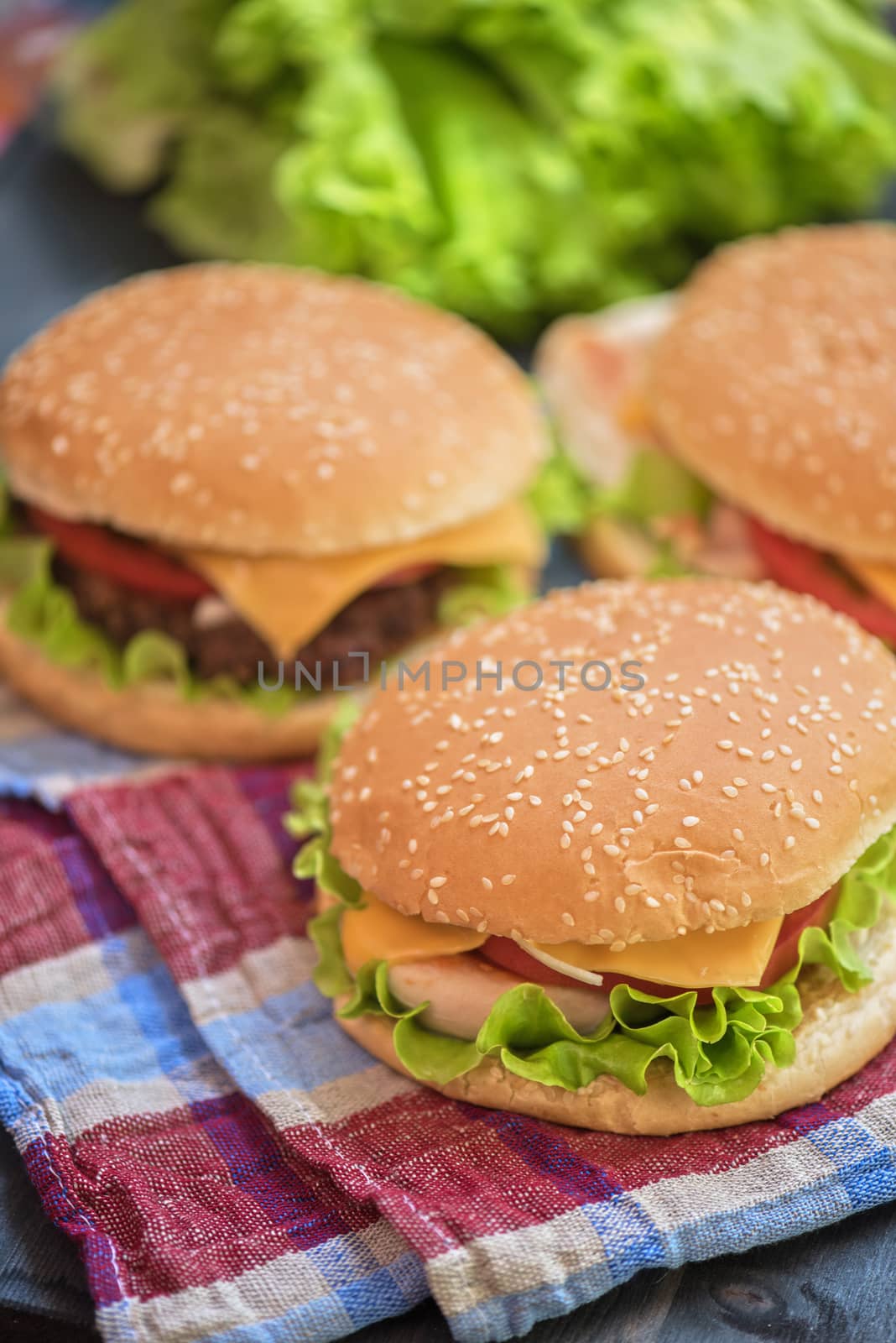 Closeup of home made burgers on wooden table