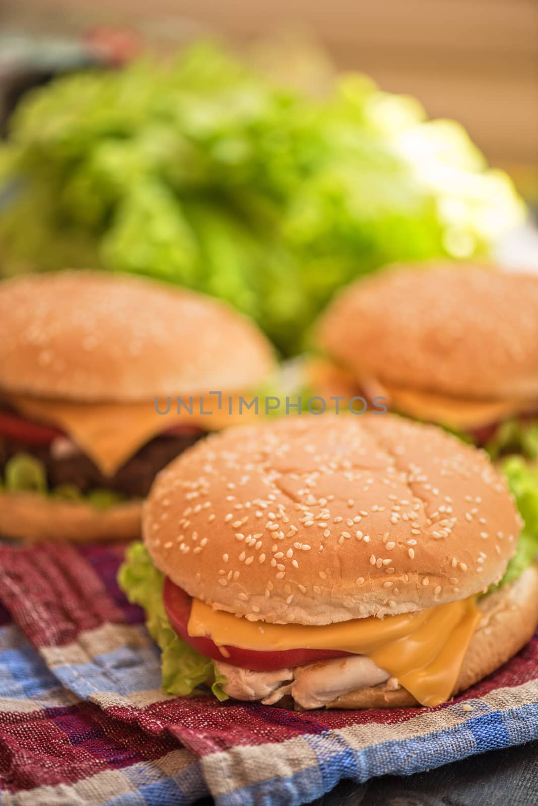 Closeup of home made burgers on wooden table