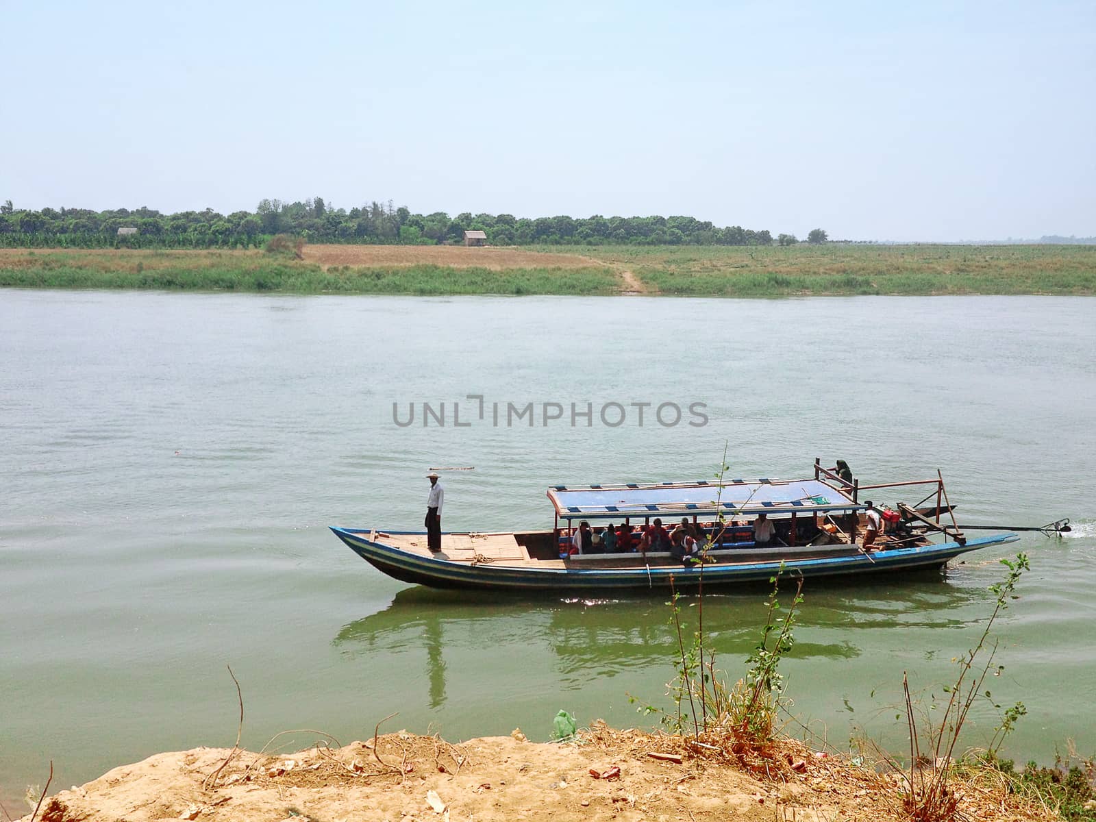 INWA, MYANMAR - April 21, 2013 : River boat taking locals,bikes, by orsor