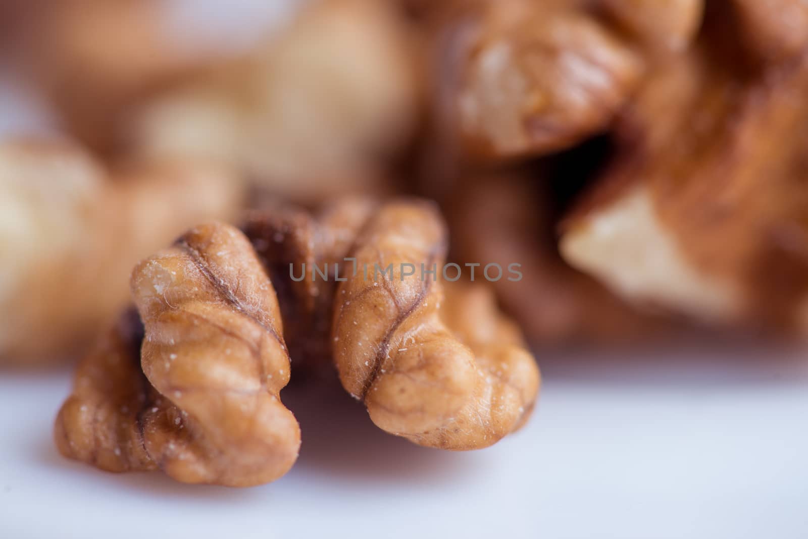 Close-up walnut on a white background. Macro shot