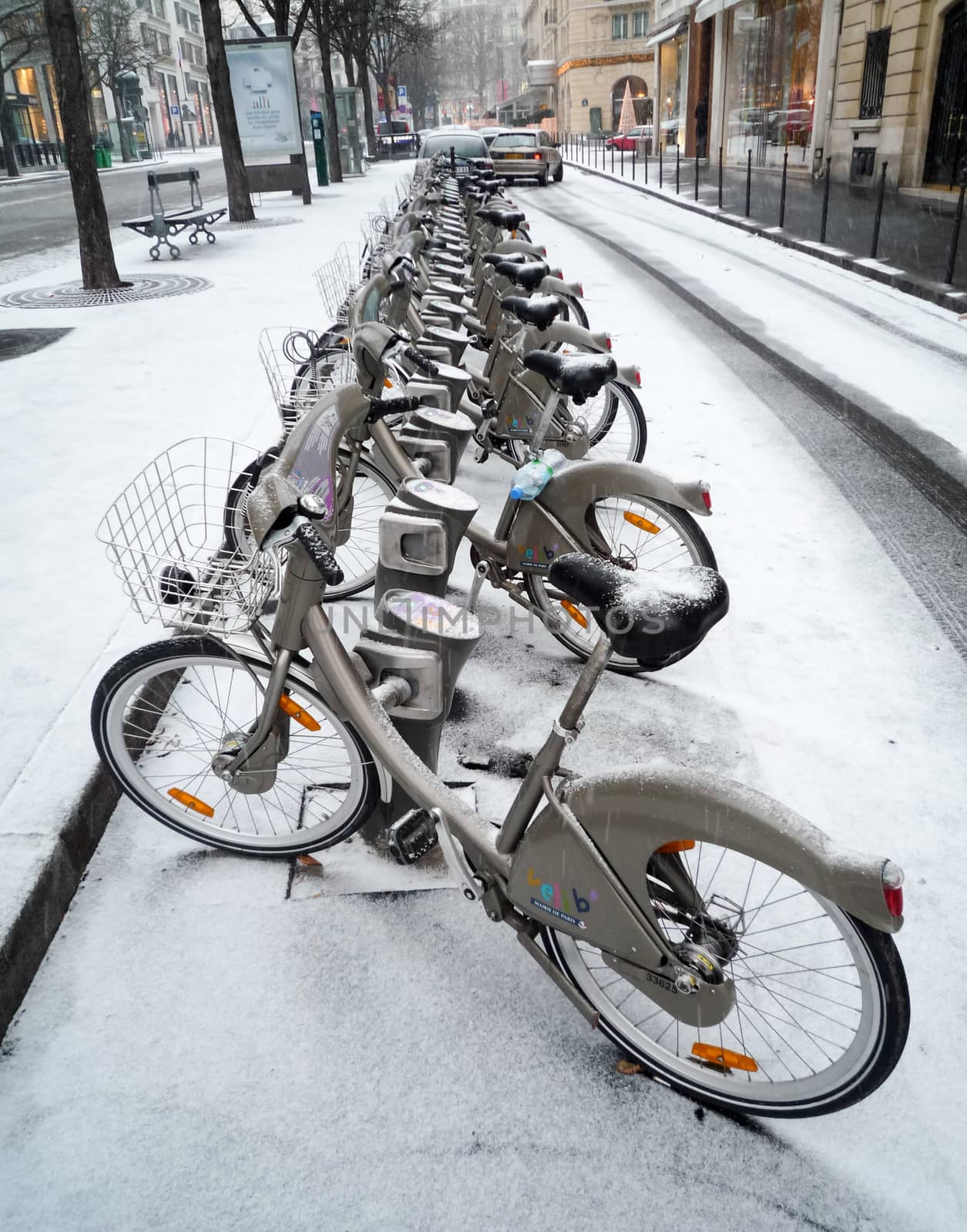 Velib' station after a snow fall in Paris by dutourdumonde