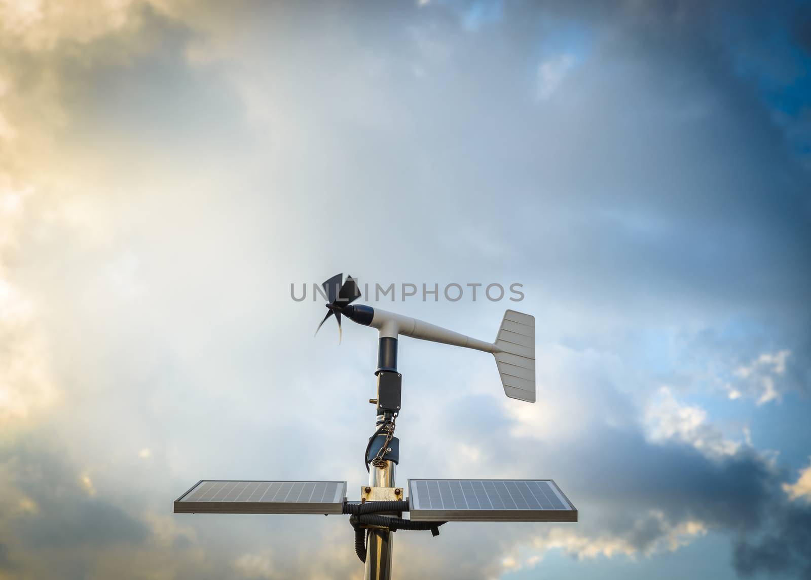 A solar powered anenometer against a dramatic stormy sky